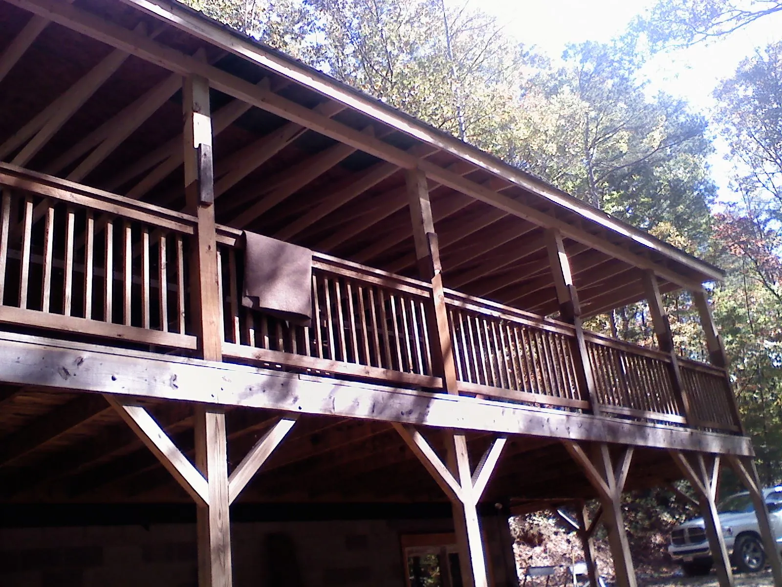 Timber framing under a new elevated porch and deck — Roof Leak Repair in Hawk Springs by Roofing Brothers